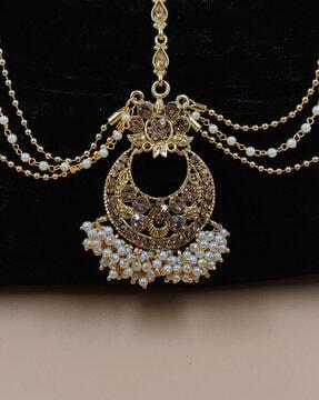 gold-plated kundan-studded bridal matha patti with pearl accent