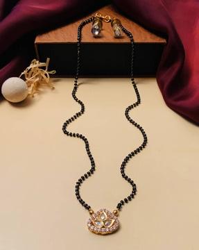 gold-plated kundan-studded mangalsutra with earrings