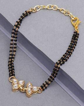 gold-plated mangalsutra bracelet with lobster claw closure