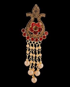 gold-plated stone-studded brooch