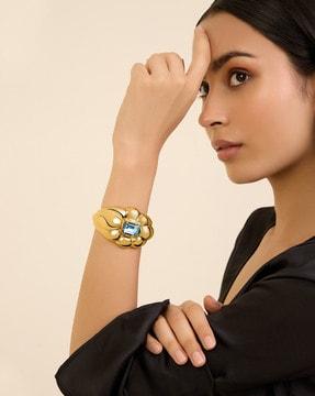 gold-plated stone-studded cuff bracelet