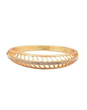gold-plated stone-studded feather cuff bracelet