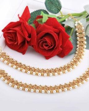 gold-pleated kundan anklets