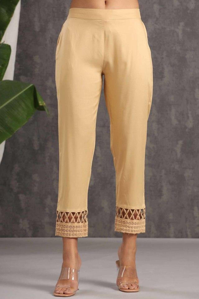 gold solid rayon ankle-length slim fit pants.