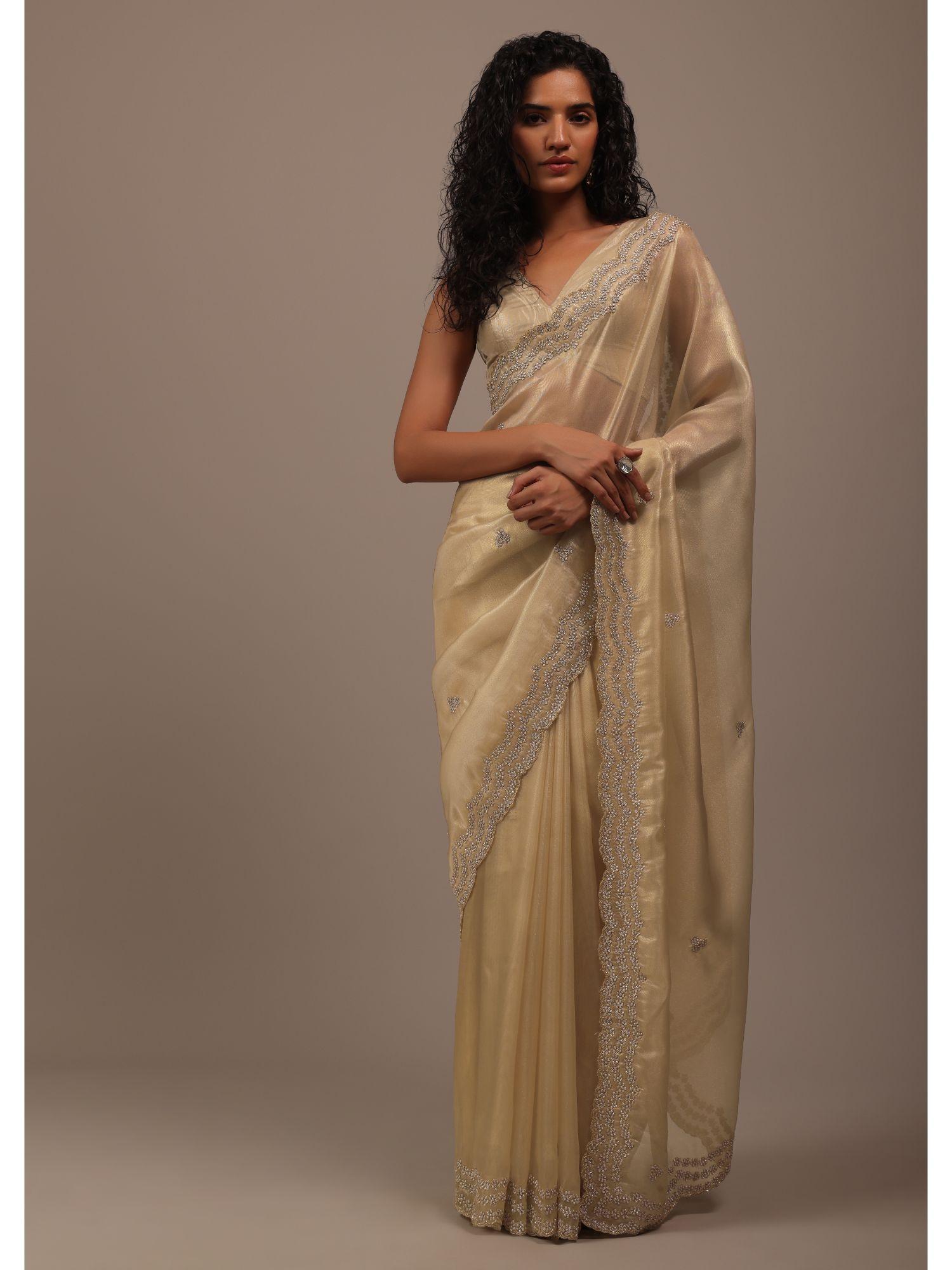 gold toned foil saree in tissue with cut dana embroidered borders with unstitched blouse
