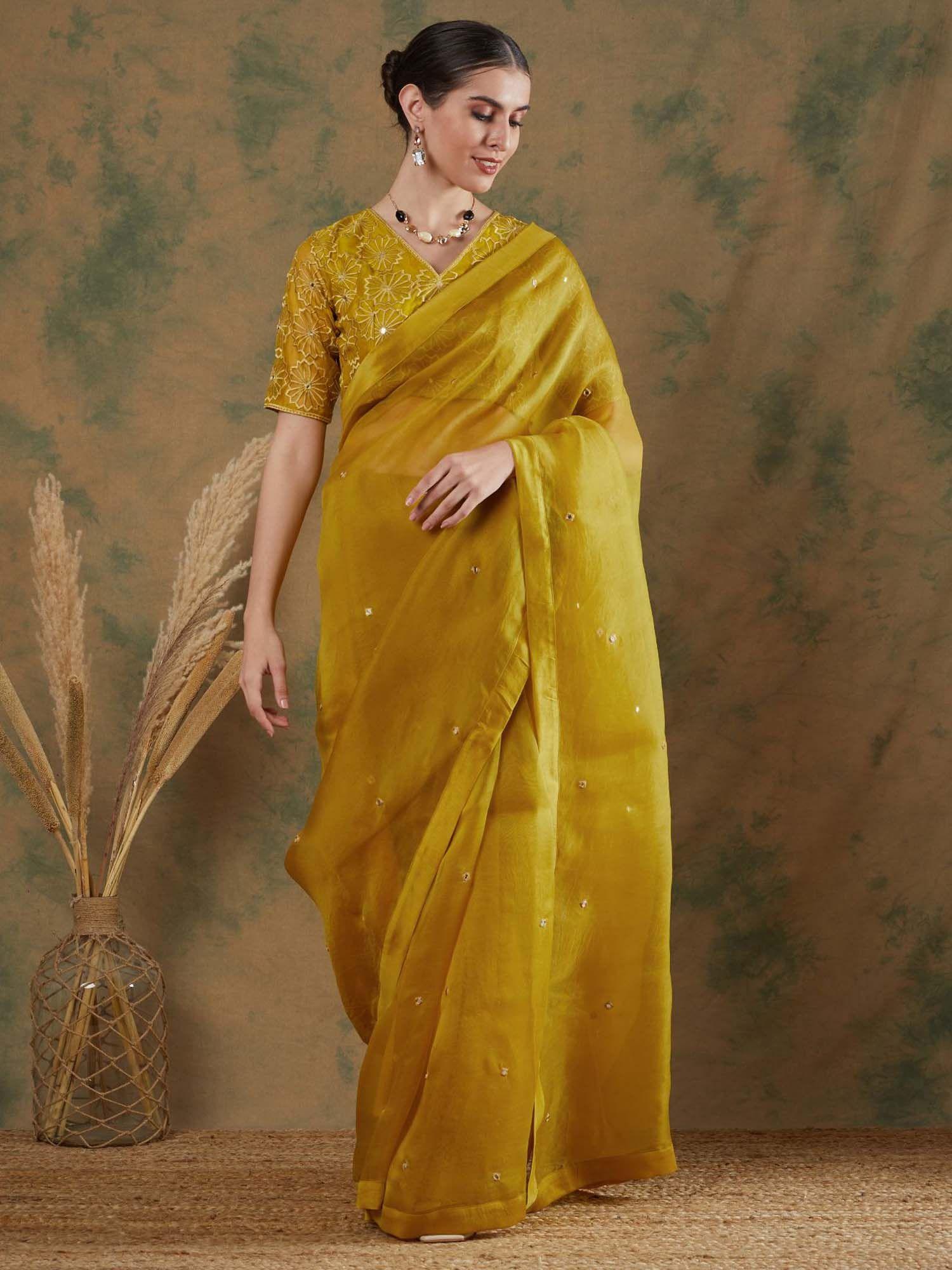 golden yellow embroidered saree with stitched blouse