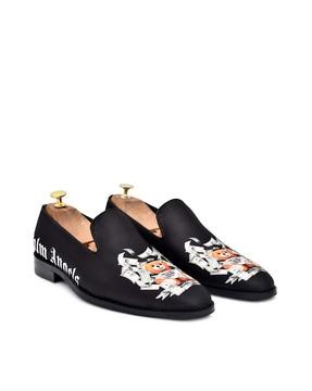 graphic print slip-on shoes