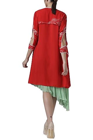 green asymmetrical tunic with red embroidered jacket