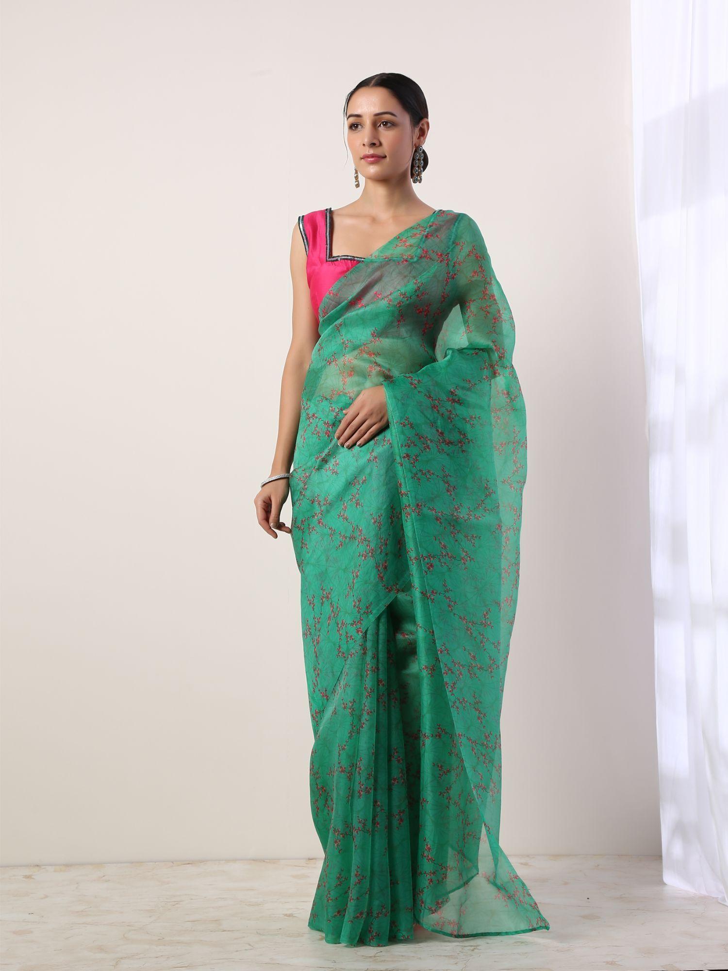 green floral printed organza saree with stitched blouse