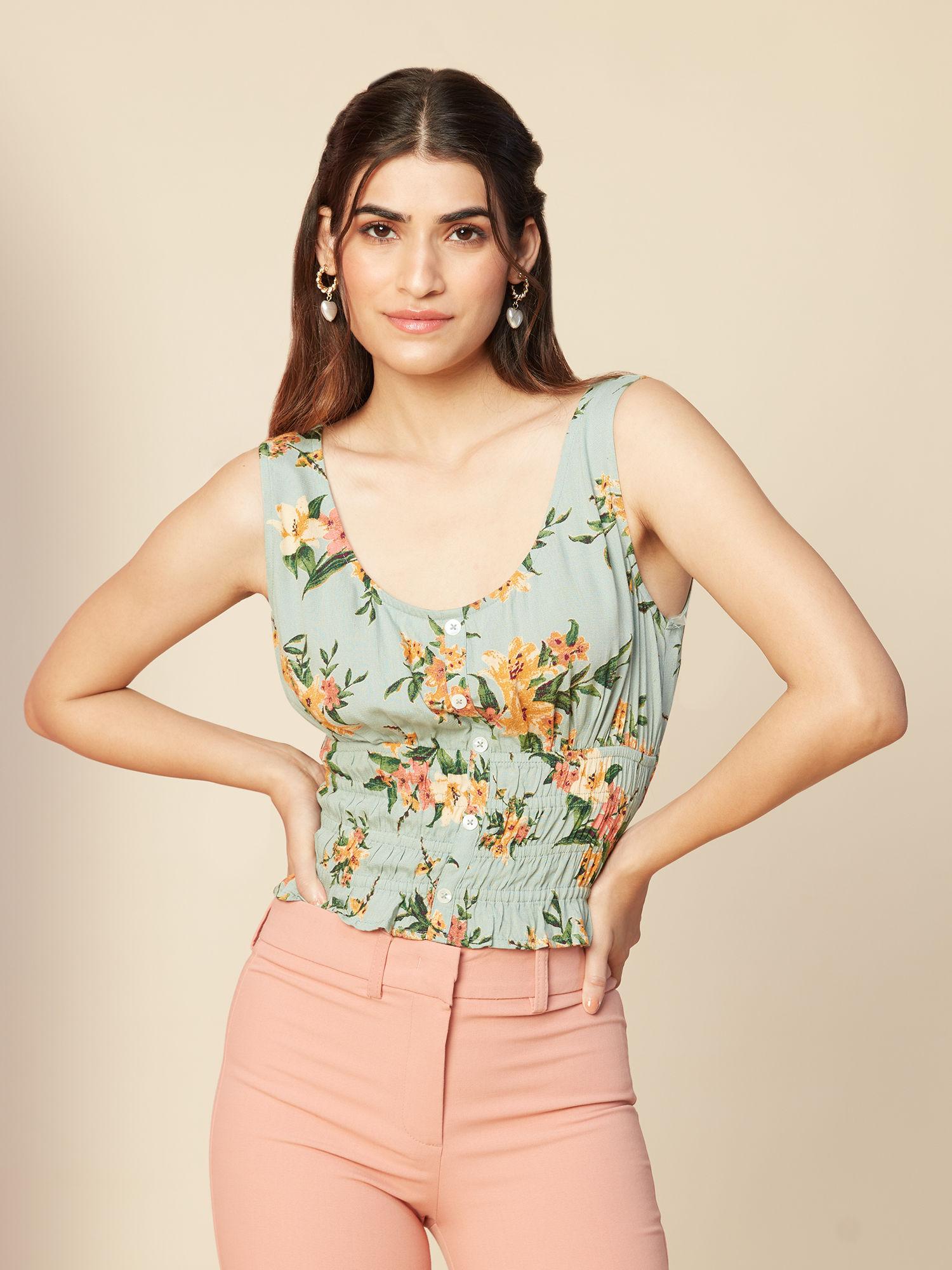 green floral printed round neck sleeveless peplum top