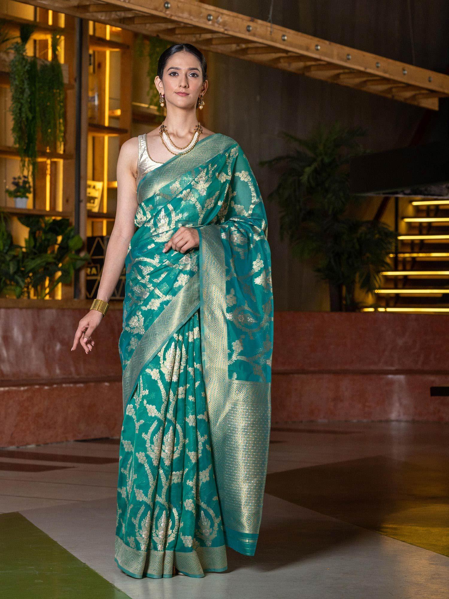green gold-toned zari organza saree with unstitched blouse