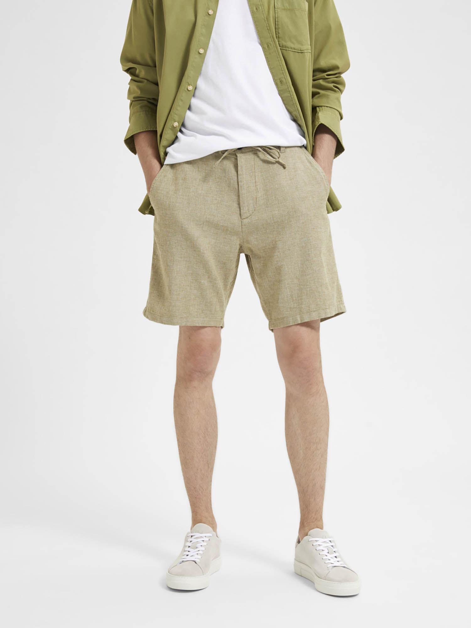green mid rise linen shorts
