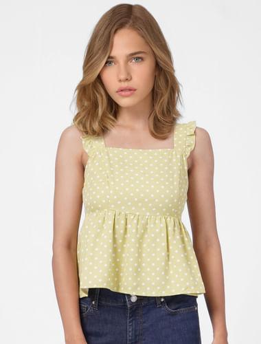 green polka dotted peplum top