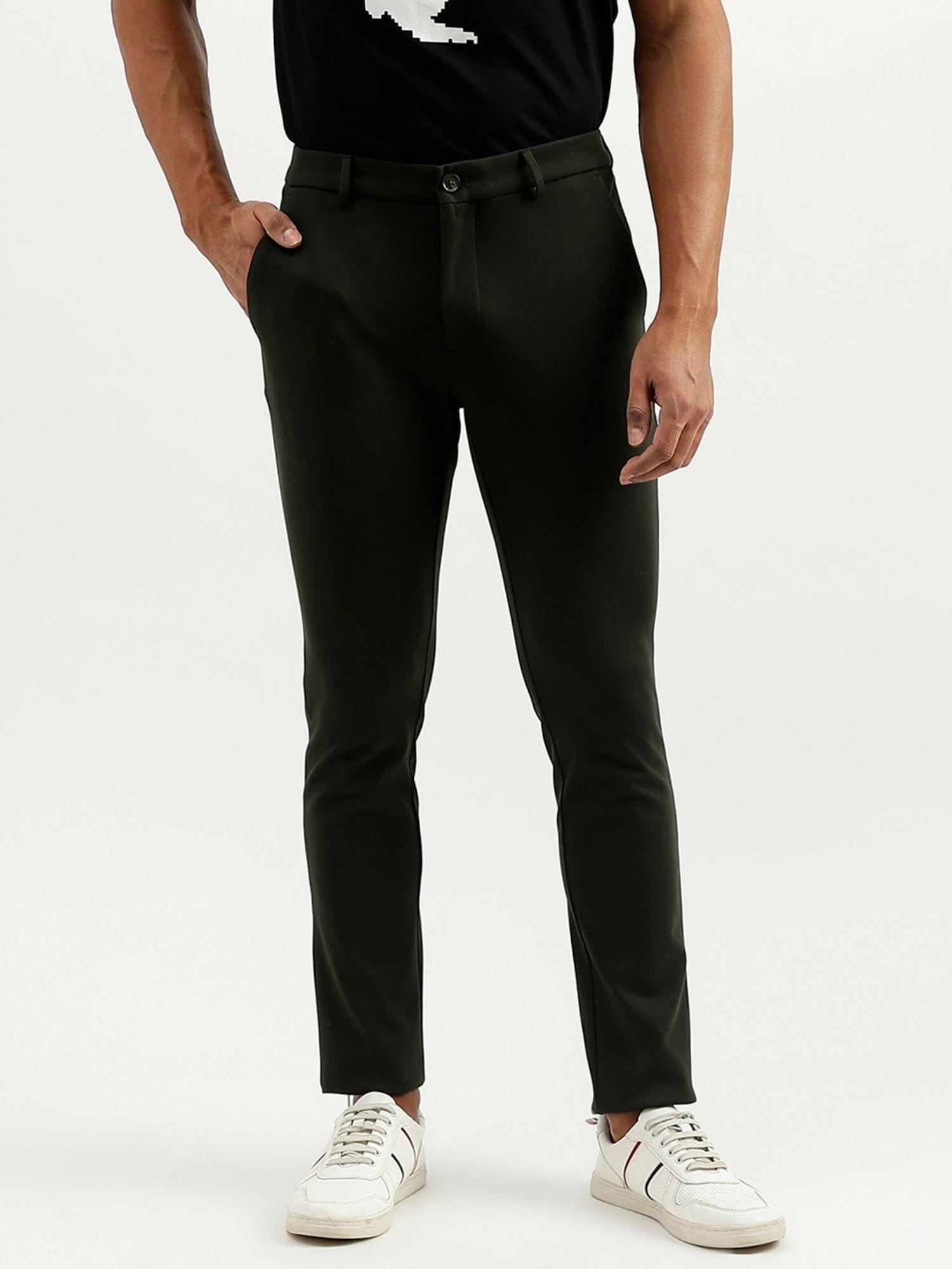 green solid slim fit trousers