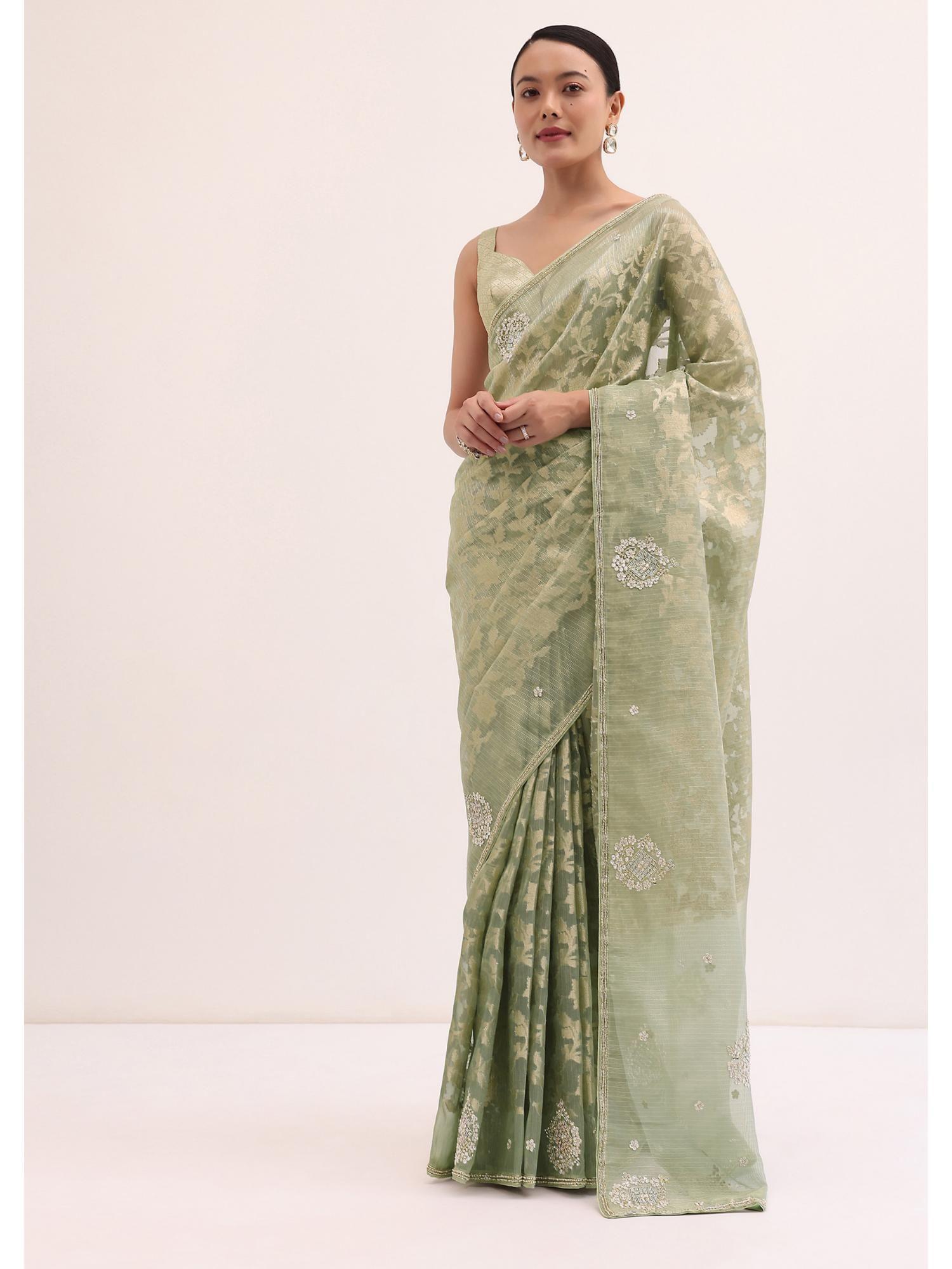 green stone embroidered tissue saree with unstitched blouse