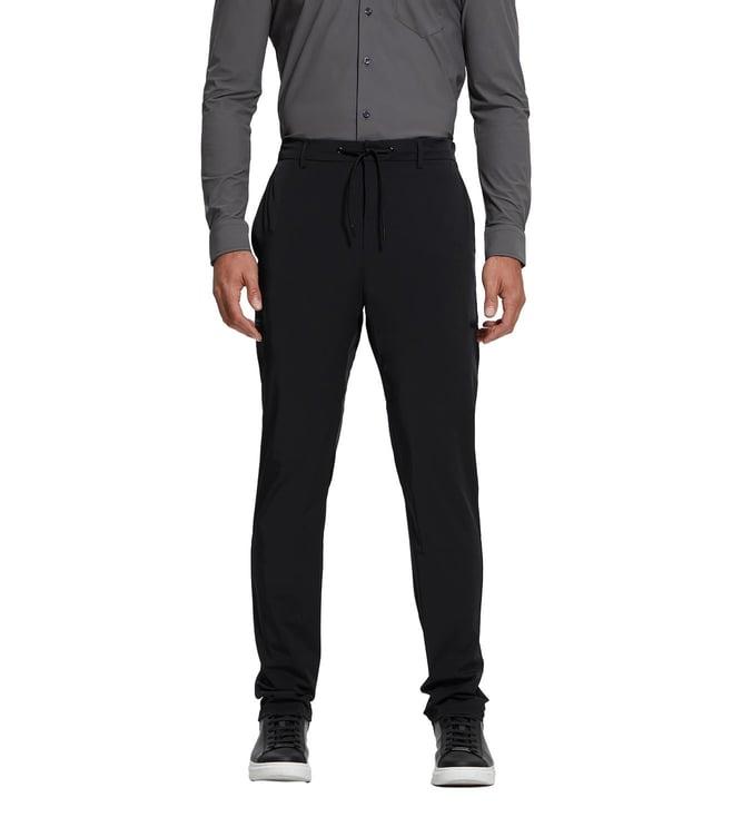 guess men's black polyamide solid slim fit trousers