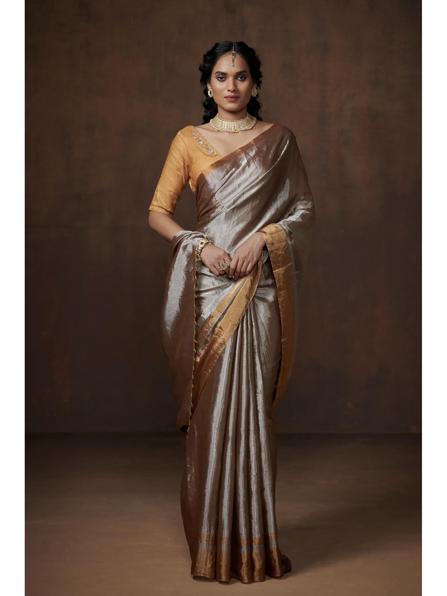 handwoven metallic silver with golden zari tissue saree having beads edge with matching blouse