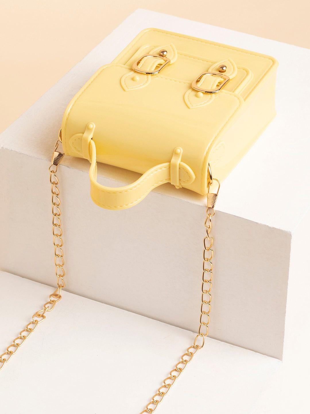 haute sauce by campus sutra yellow embellished pu structured sling bag