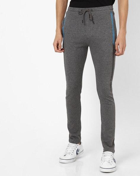 heathered fitted track pants with typography
