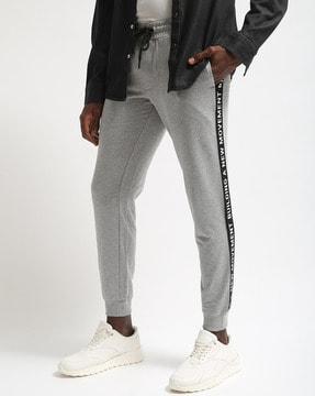 heathered slim fit joggers with typographic print side taping