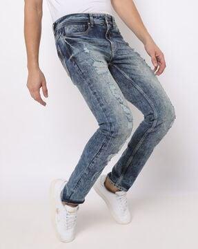 heavily washed distressed slim fit jeans