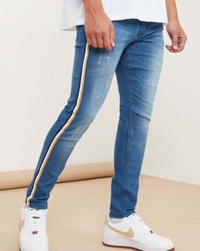 heavily washed jogger jeans with contrast taping