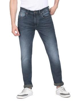 heavily washed slim tapered fit jeans