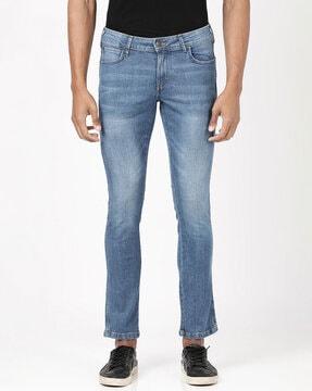 heavily-washed slim fit jeans