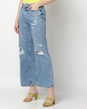 heavily washed distressed bootcut jeans