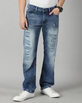 heavily washed distressed relaxed jeans