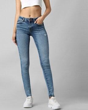 heavily washed distressed skinny fit jeans