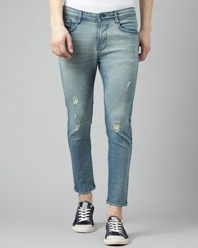 heavily washed distressed skinny fit jeans