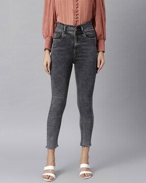 heavily washed jeans with fringed hem