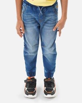 heavily washed jogger jeans with drawstring waist