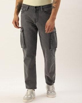 heavily washed relaxed fit jeans with flap pockets