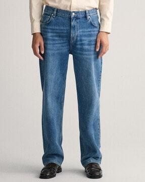 heavily washed relaxed fit jeans