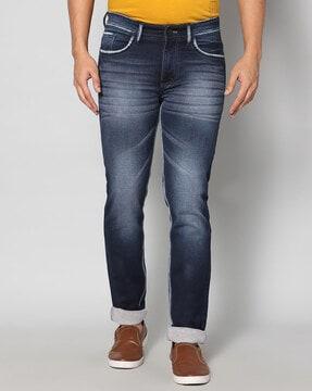 heavily washed relaxed fit jeans