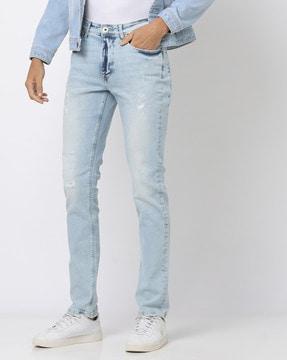 heavily washed ripped slim fit jeans