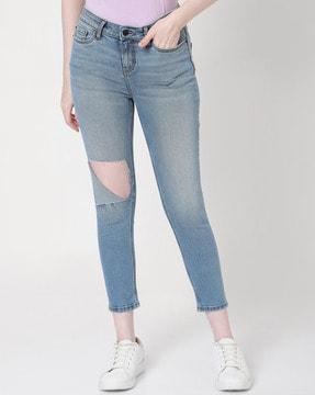 heavily-washed skinny jeans with 5-pocket styling