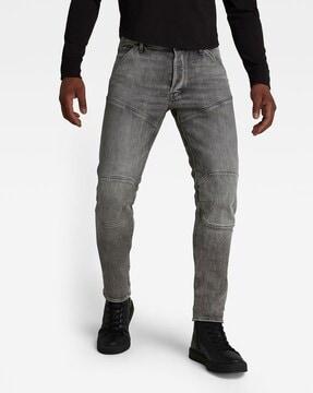 heavily-washed slim fit jeans