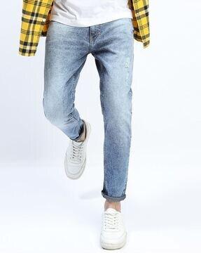 heavily-washed slim fit jeans