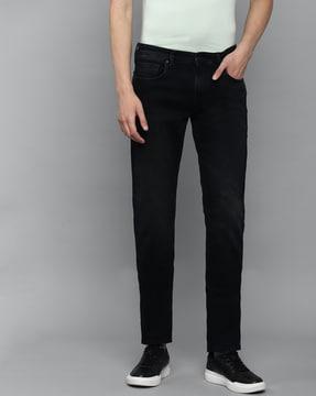 heavily-washed slim fit jeans