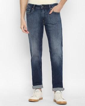 heavily washed slim jeans