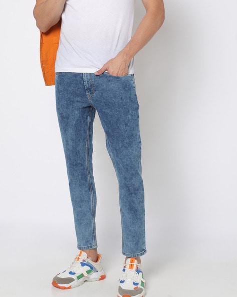 heavily washed slim tapered fit jeans