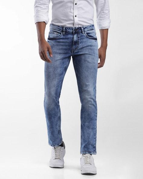 heavily washed tapered fit jeans