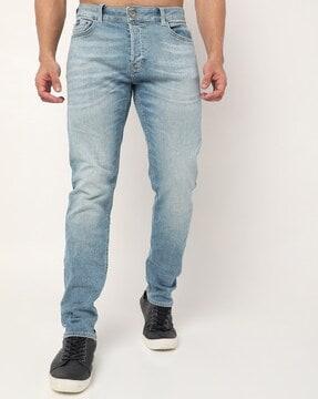 heavily washed tapered fit jeans