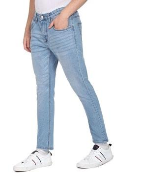 heavily washed tapered fit jeans