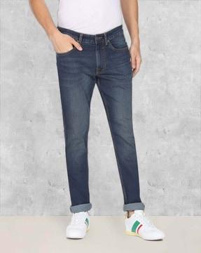 heavily washed tapered jeans