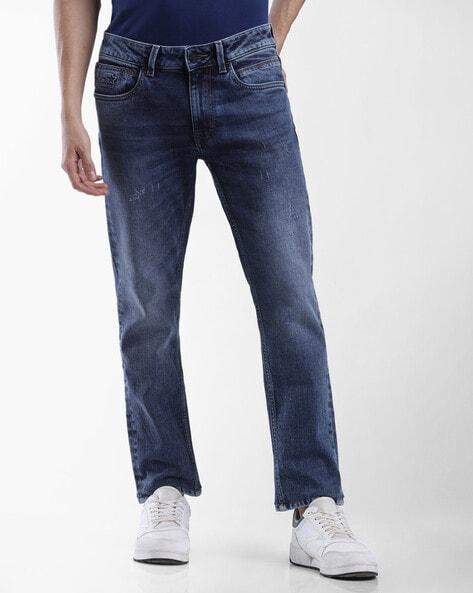 heavily washed tappered fit jeans