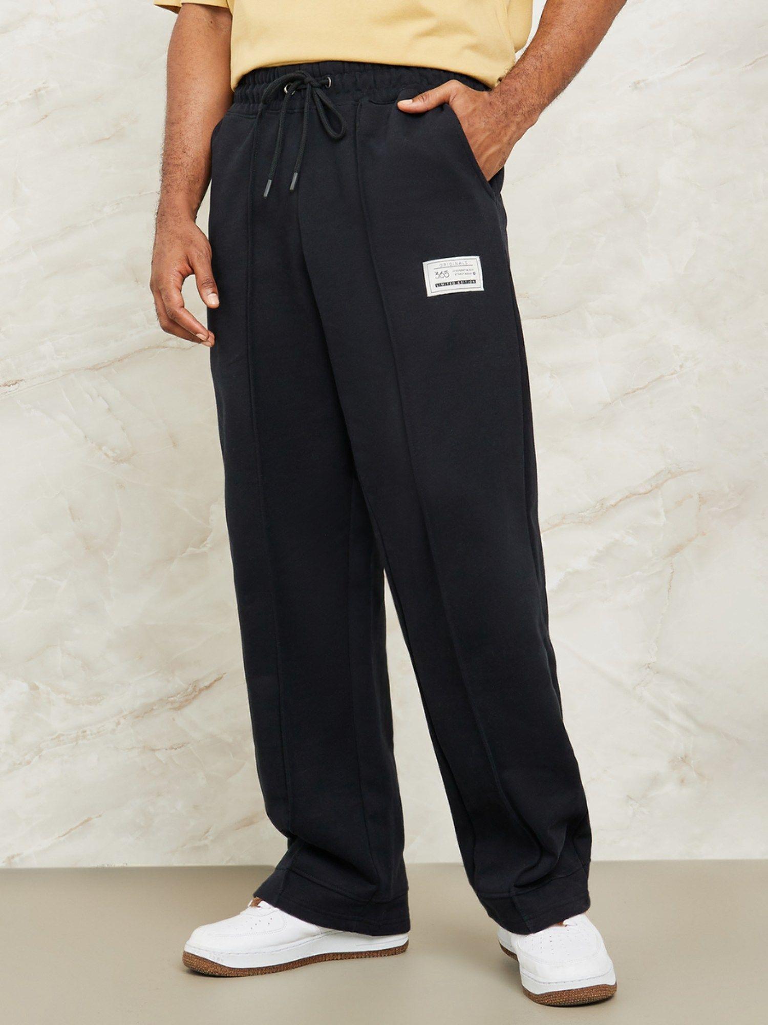 heavy fleece pintuck trackpants with badge detail black